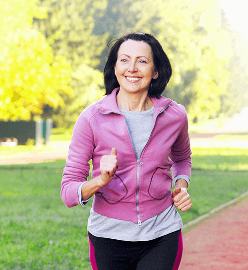 Woman running and smiling
